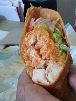 Buffalo chicken wrap with cheese, lettuce tomato and some more I forget.