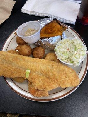 Fried flounder, fried shrimp, coleslaw, baked sweet potato and hush puppies