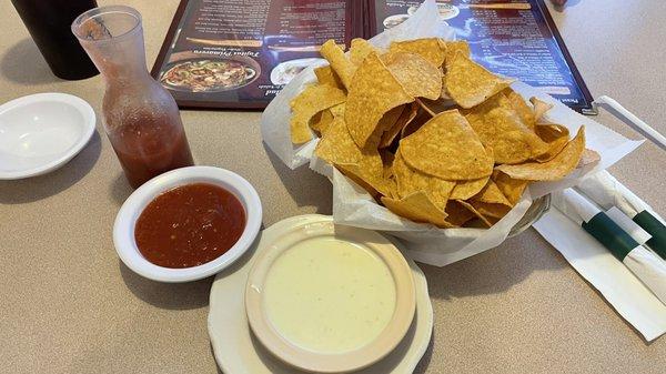 Complimentary chips and salsa plus a small cheese dip