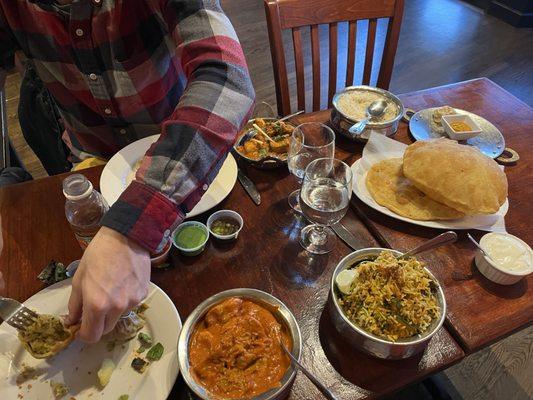 Veg Momo Masala, Vegetable Biryani, 2 Piece Vegetarian Samosa, Poori, Chicken Vindaloo.