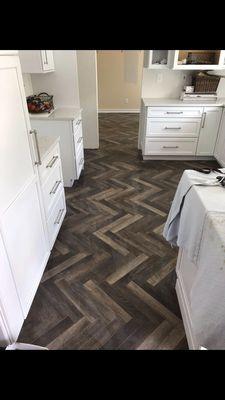 Herringbone pattern tile flooring.