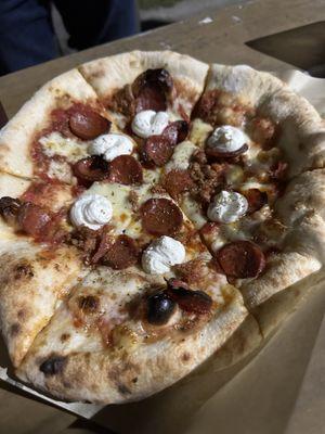 The Yankee: red sauce, italian sausage, pepperoni, ricotta cream, cheese, oregano, extra virgin olive oil