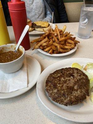 Burger and cheeseburger with extra crispy fries as requested, and no beans chili.