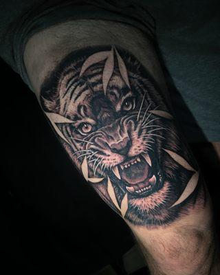 Black and gray tiger tattoo.