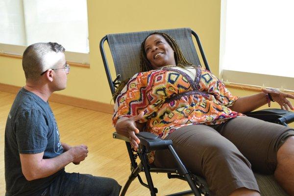 Ren discusses a treatment at BAP's Meet and Greet, Intro and Demo kickoff event at 4 Corners Yoga + Wellness, July 23, 2017