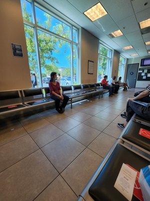 The small lobby with 2 seats blocked between every seat. The CDC says we no longer have to wear masks or social distance.