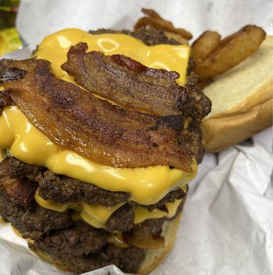 Triple cheeseburger with bacon: no veggies and fries