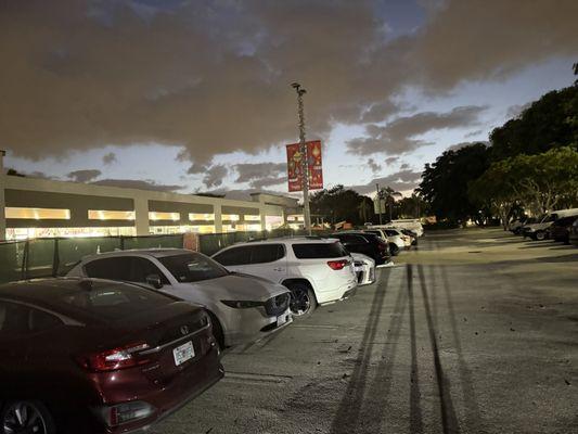 Poorly lit parking lot.