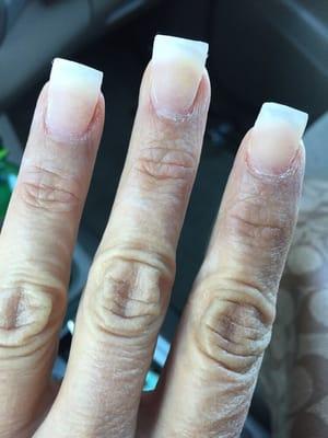 Really you let a client leave with her nails like this... Poor service