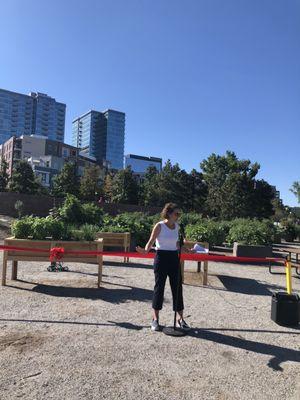 Jenna Harris of Denver Parks at the ribbon cutting of the Commons Park garden - with the gardens behind her.