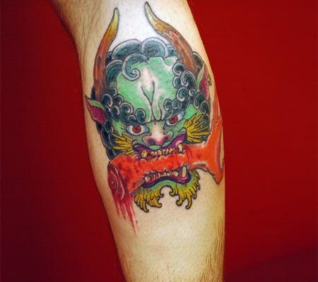 Japanese Oni biting arm.