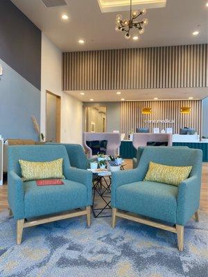 Lobby seating and the check in counter in the background