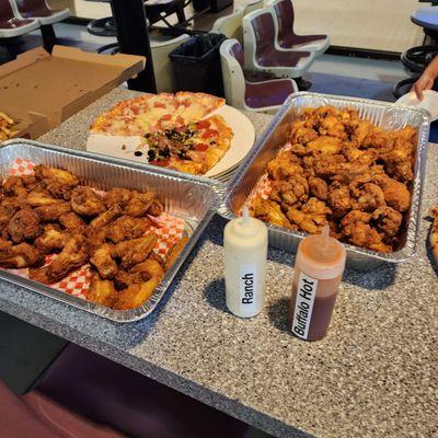 Chicken wings and pizzas