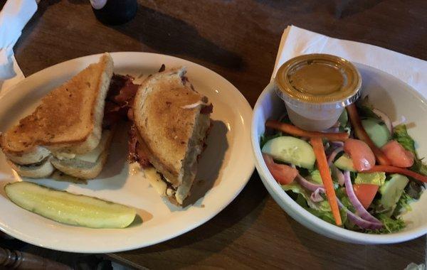 Pastrami sandwich and side salad