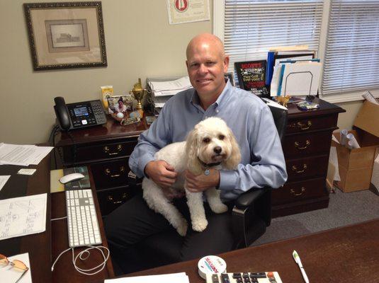 Our Founder, Scott Gilkey, holding our company mascot, "Buddy".