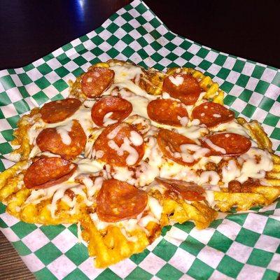 One our many weekly specials the famous "Pizza Fries".  Waffle fries topped with our homemade sauce, mozzarella and pepperoni.