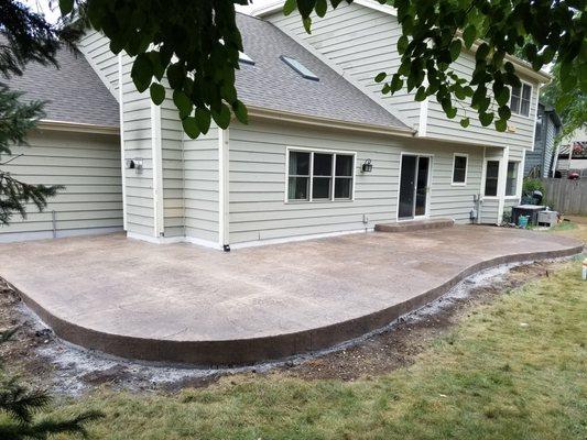 raised stamped patio. Patio was raised to help control water way