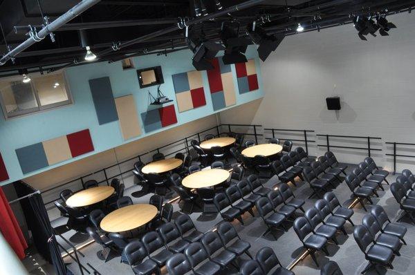 Theater #2. Can be set-up in any combination of tables or chairs. Full movie screen. Private rentals available.