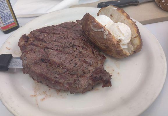 10 ounce rib eye with baked potato