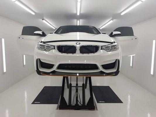 BMW M4 GTS receiving Paint Protection Film and Ceramic Coating