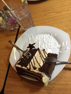 Chocolate Peanut Butter Cake. The middle is peanut butter cheesecake. It was delicious and free because it was my husbands birthday.