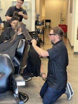 My daughter getting her hair cut , this gentlemen was very patient with her we loved  our hair cut thank you so much