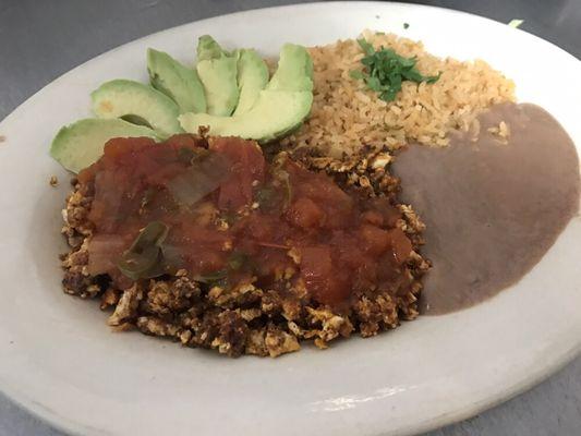 Special Made Breakfast Plate- Huevo Con Chorizo with salsa ranchera; rice,beans and avocado on the side