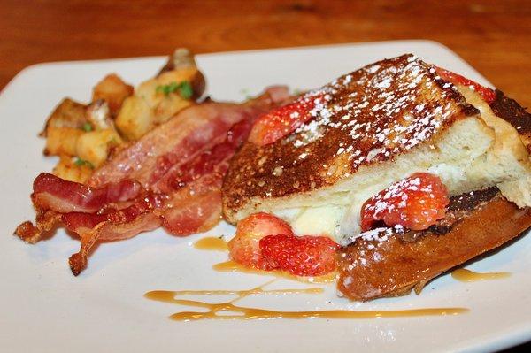 The Sourdough French Toast was made with bourbon banana syrup, mascarpone, and strawberries (Gluten Free option available).