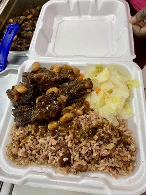 Oxtail with rice & peas and steamed cabbage