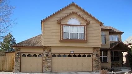 This tan home with darker tan trim really stands out against the clear blue skies of Elizabeth in this photo.