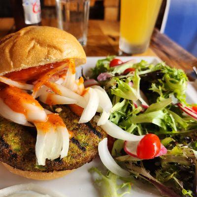 Good veggie burger with a side salad