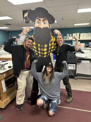 Design/Production team stands with a larger than life custom Yosef stand up we made for AppState. Remeber: We are an AppState Licensed Print