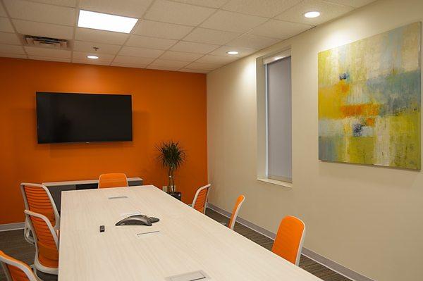 Large Meeting or Conference room with 65" screen, phone, and whiteboard