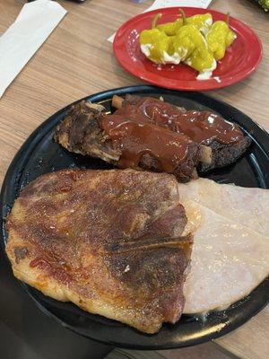 Multiple meats, ribs and pork steak