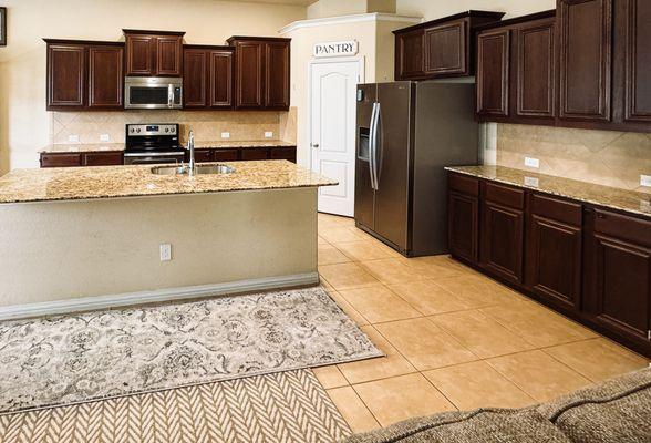 BEFORE (cabinets were very dark and the trim on some of them was unstable and only loosely attached)