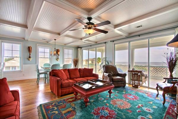 Queen Bee Living Room equipped with comfy couches, a flat screen TV and ocean views