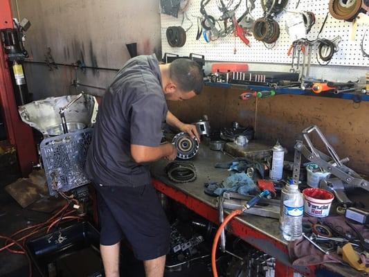 One of our technicians  rebuilding a transmission for a Chevy Tahoe famous 4l60E