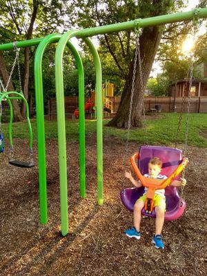 #purple&orangeswing with the #junglegym in the back ground @chase&Ferguschildrenspark @norhside @yelpcincy