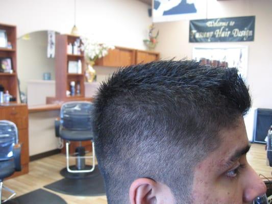 The High and  Tight. Shaved sides and back, blending to a shredded classic clean square cut.
2 of 3