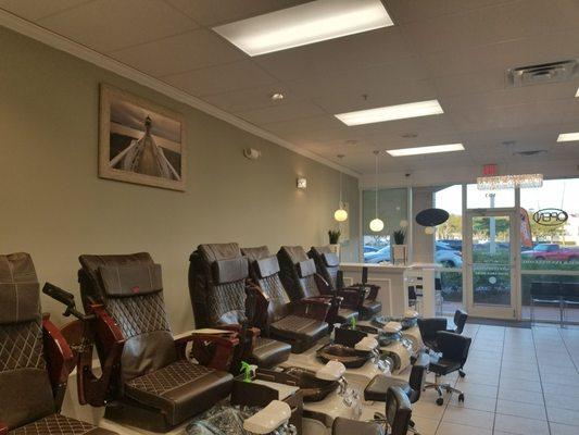 Peaceful environment with new massage pedicure chairs.