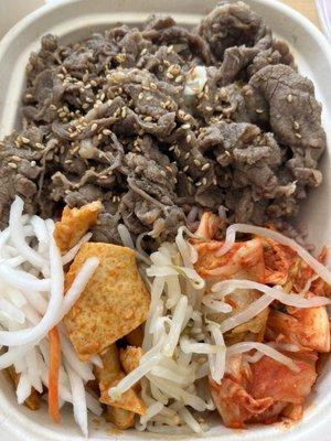 Beef Bulgogi Bowl with pickled radish, fish cake, bean sprouts, and kimchi