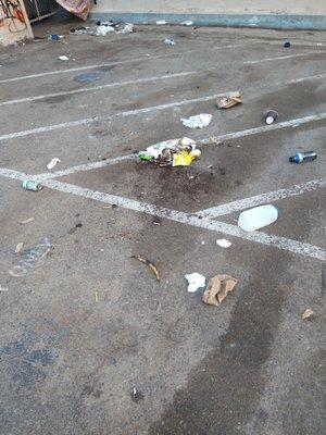 This is a before and after shot of where the trash and feces were and where ABM employee swept it.