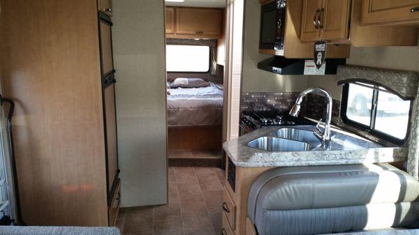 Interior of 2018 Thor Chateau 28' RV. Rear queen master, split shower and bathroom, full kitchen.