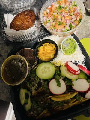 Birria Tacos, black beans with rice, pico de gallo, and Salvadoran plantain