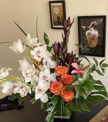 Beautiful arrangement with orchids and so fresh.