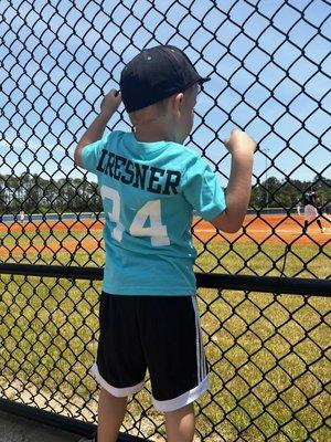 Baseball backstop (with my little cheering on my big)