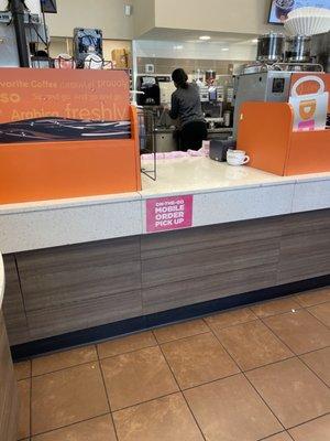 8 mobile orders tickets laying in the counter while they laugh and joke around. It took more than 15 min for me to get one iced coffee.