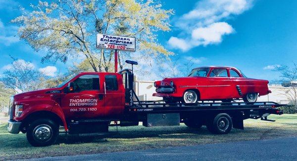 Safe transport of a classic car by Thompson Enterprises expert towing services.