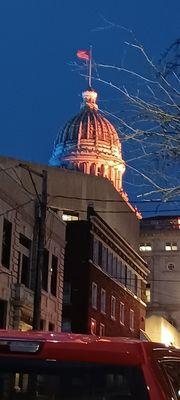 Dome is lit up with blue and yellow lighting.