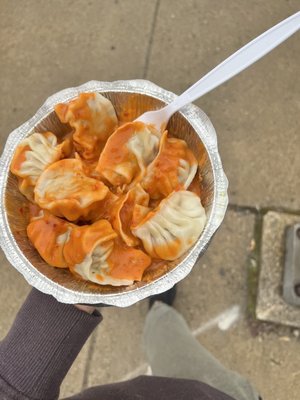 Steam Dumplings (MOMO) with tomato sauce, eating on the walk home bc I couldn't resist for even 5 minutes lol